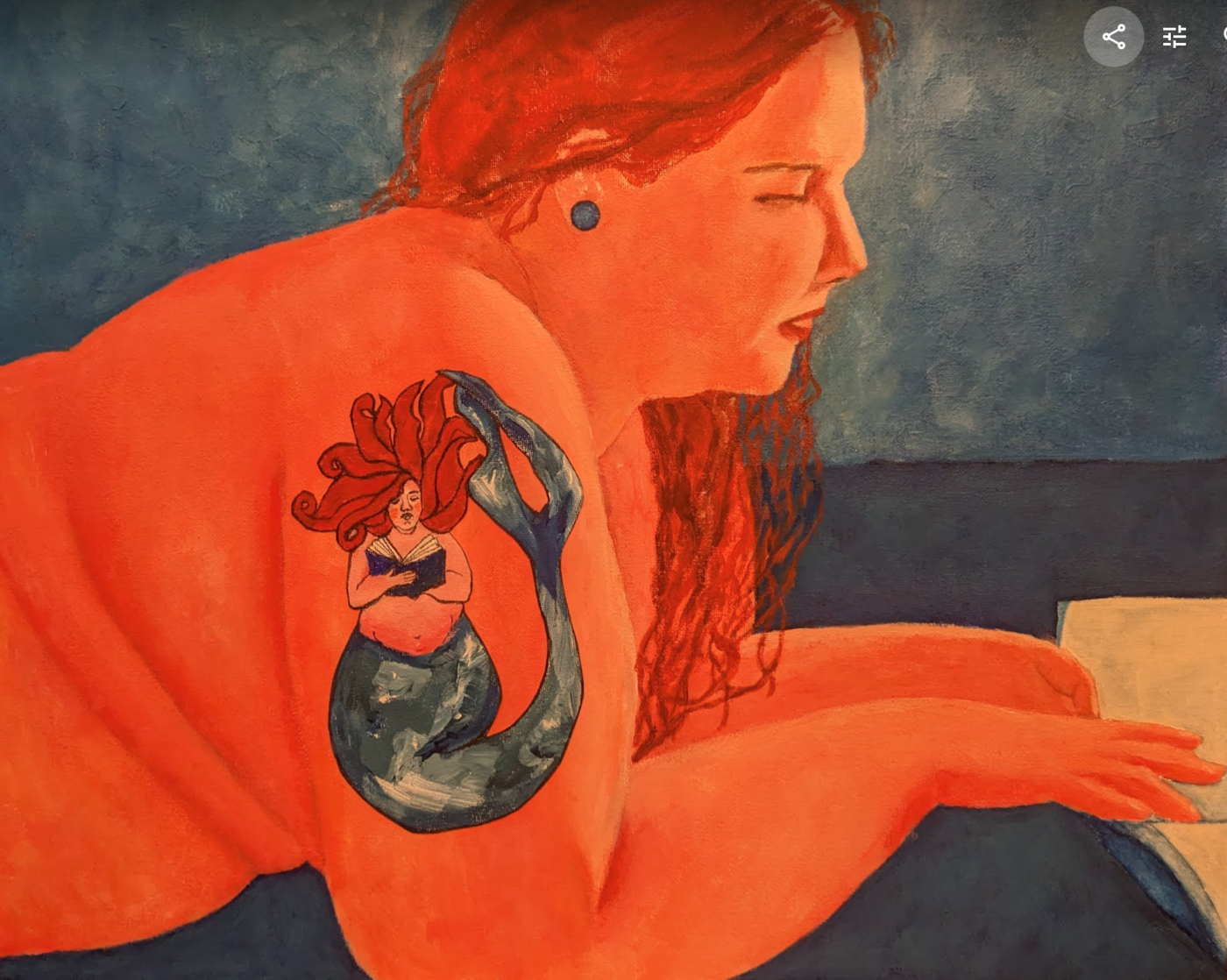 A painting of a young feminine person with bright orange skin and a tattoo of a mermaid reading. The person is lying down and reading as well.